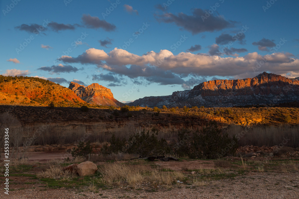 Strongly contrasted and colourful mountain panorama in Springdale, near Zion National Park, Utah, USA, at sunset