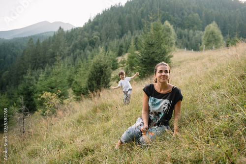 Young mom with baby boy travelling. Mother on hiking adventure with child, family trip in mountains. National Park. Hike with children. Active summer holidays. Fisheye lens photo