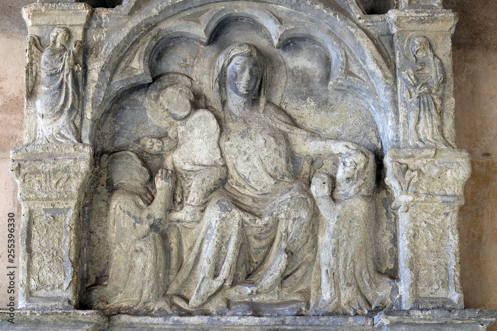 Virgin Mary with baby Jesus, relief in the Santa Maria Novella Principal Dominican church in Florence, Italy
