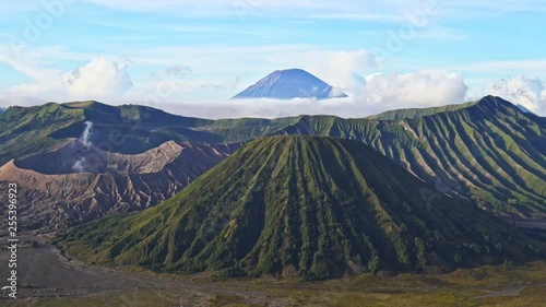 Mount Bromo is an active volcano and part of the Tengger massif, in East Java, Indonesia., Panning Left, Panning. photo