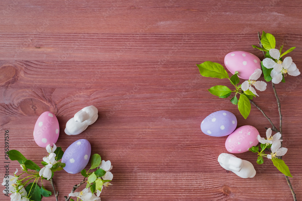 Flat lay composition with white spring flowers and easter eggs on a wooden background Flat lay composition with white spring flowers and easter eggs on a wooden background