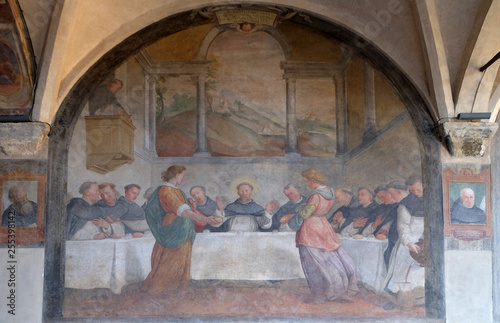 San Dominic in Mensa fed by the Angels, fresco by Santi di Tito in the cloister of Santa Maria Novella Principal Dominican church in Florence, Italy