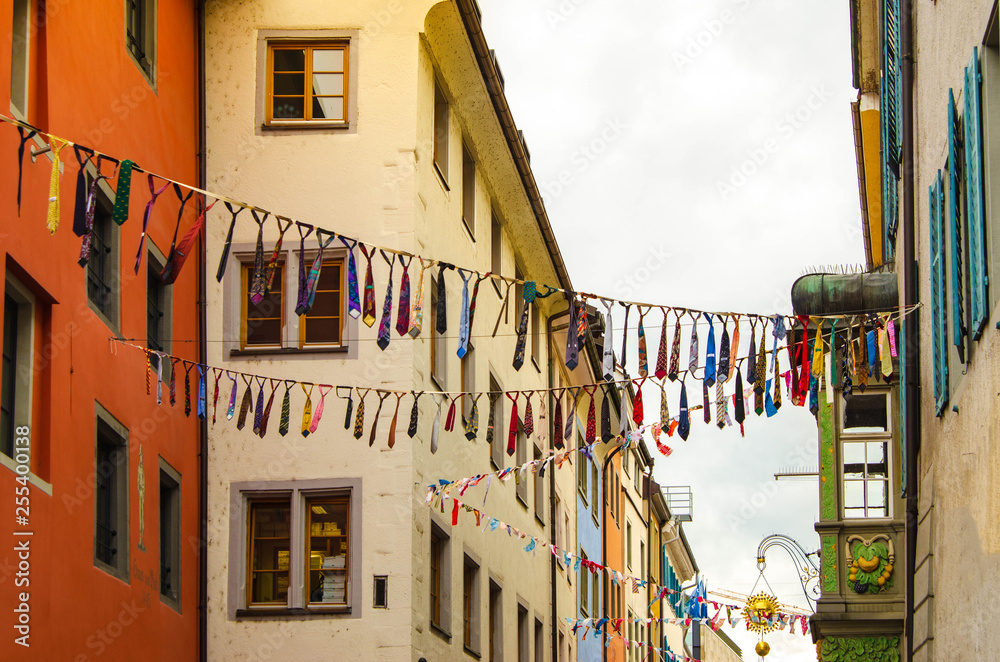 street decorated with garlands of men's ties for the holiday