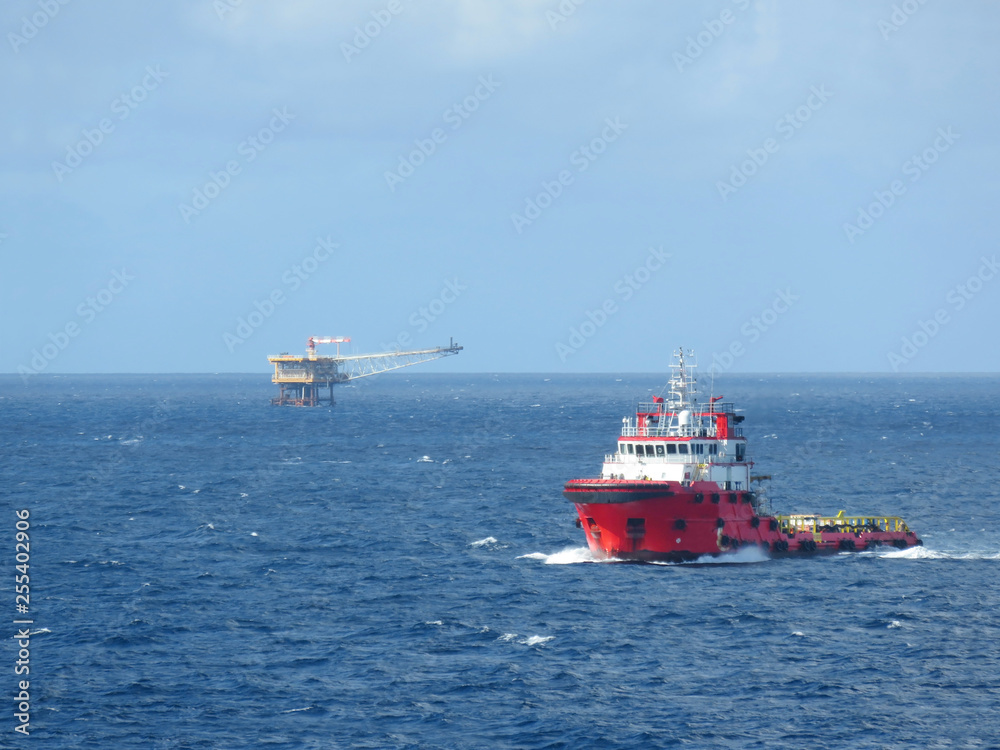 Supply boat support oil and gas industry. Supply boat transfer cargo to oil and gas industry and moving cargo from the boat to the platform. Boat is waiting transfer cargo and crews to platform. Supply boat support oil and gas industry. Supply boat transfer cargo to oil and gas industry and moving cargo from the boat to the platform. Boat is waiting transfer cargo and crews to platform.