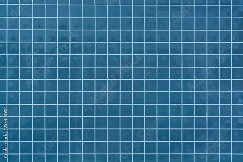 Deep blue tile mosaic texture. Ceramic tile wall background