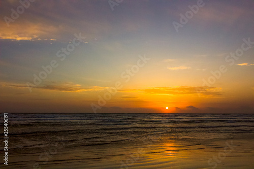 Sun rising over the mediterranean sea  the waves coming to the shore for this holiday background  love holidays  love the beach