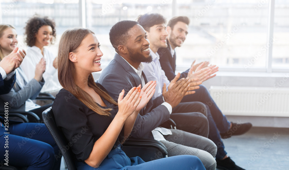 Business seminar. Colleagues clapping hands in office Business seminar. Colleagues clapping hands in office