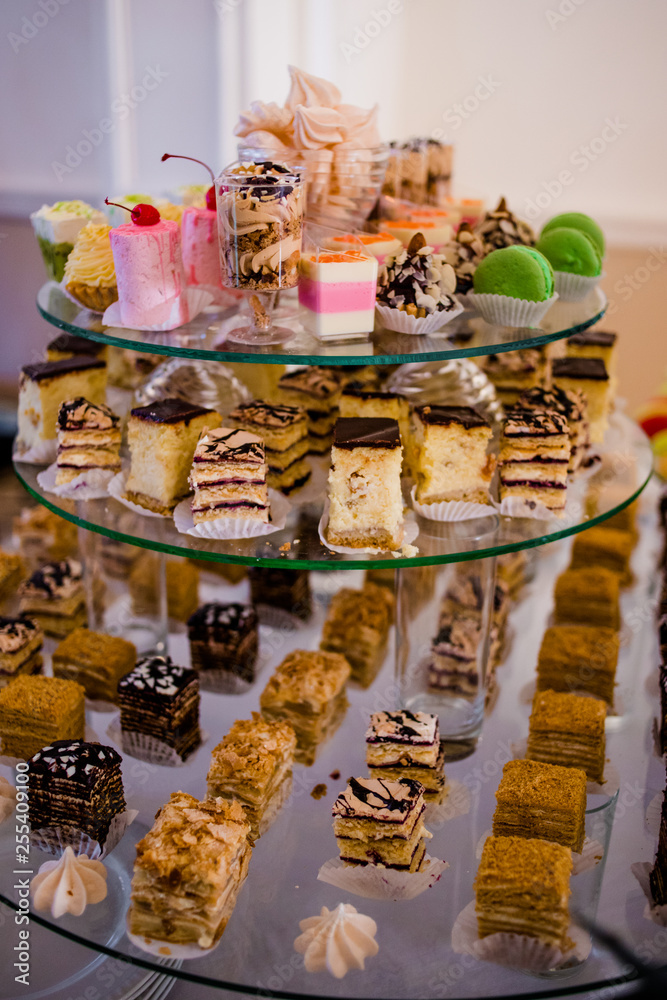 Candy bar. .Delicious cakes on saucers