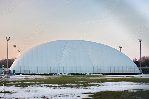 field for football or tennis in the winter time. stretched awning for protection and protection from weather conditions - snow. heating of the room for the game. sports facilities