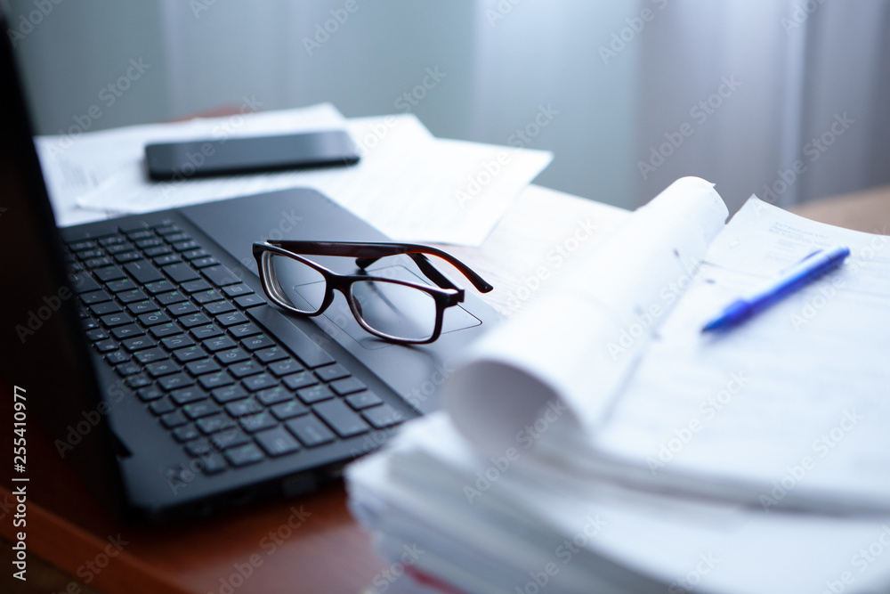 office desk a stack of computer paper reports work forms office desk a stack of computer paper reports work forms