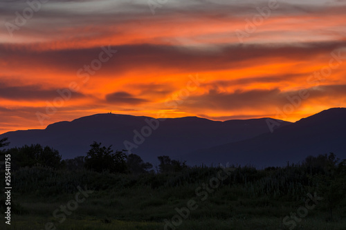 Stunning sunset over Old mountain, Bulgaria. View to Botev peak in the far distance. Landscape, travel concept.