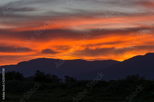 Stunning sunset over Old mountain, Bulgaria. View to Botev peak in the far distance. Landscape, travel concept.