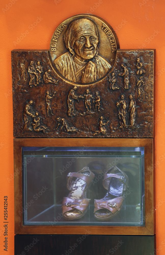 Bas relief with scenes from the life of Saint Mother Teresa of Calcutta and her sandals exposed in Chapel of Saint Dismas in Zagreb, Croatia