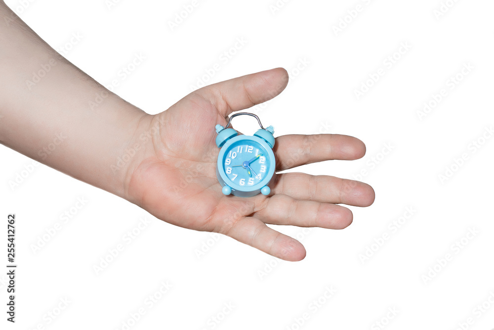 men's hand holding small blue alarm clock on white background. men's hand holding small blue alarm clock on white background.