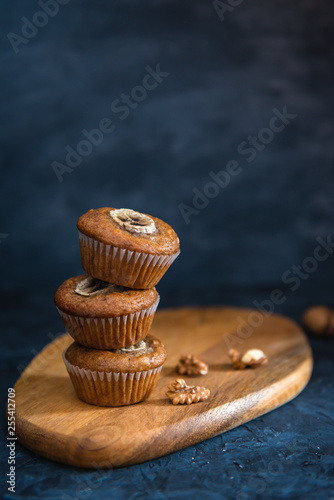Stack of Healthy vegan banana walnut muffins. Side view, copy space