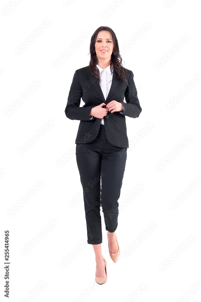 Smiling elegant young business woman walking and getting dressed. Full body isolated on white background. Smiling elegant young business woman walking and getting dressed. Full body isolated on white background.