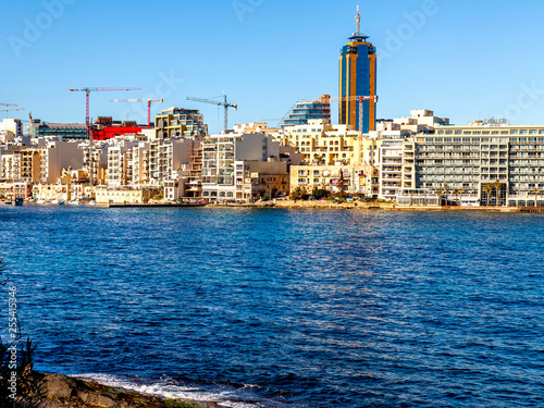 San Giljan, Malta, on January 7, 2019. View of the picturesque bay Spinola and beautiful embankment  photo