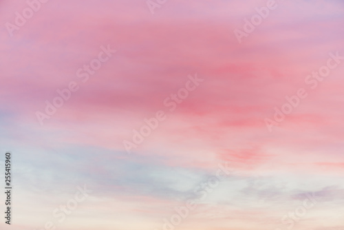 Fototapeta Naklejka Na Ścianę i Meble -  Sunset sky with multicolor light clouds. Colorful smooth sky gradient. Natural background of sunrise. Amazing heaven at morning. Slightly cloudy evening atmosphere. Wonderful weather. Pink dawn clouds