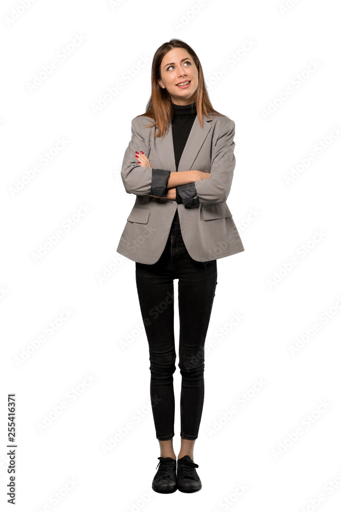 A full-length shot of a Business woman looking up while smiling over isolated white background A full-length shot of a Business woman looking up while smiling over isolated white background