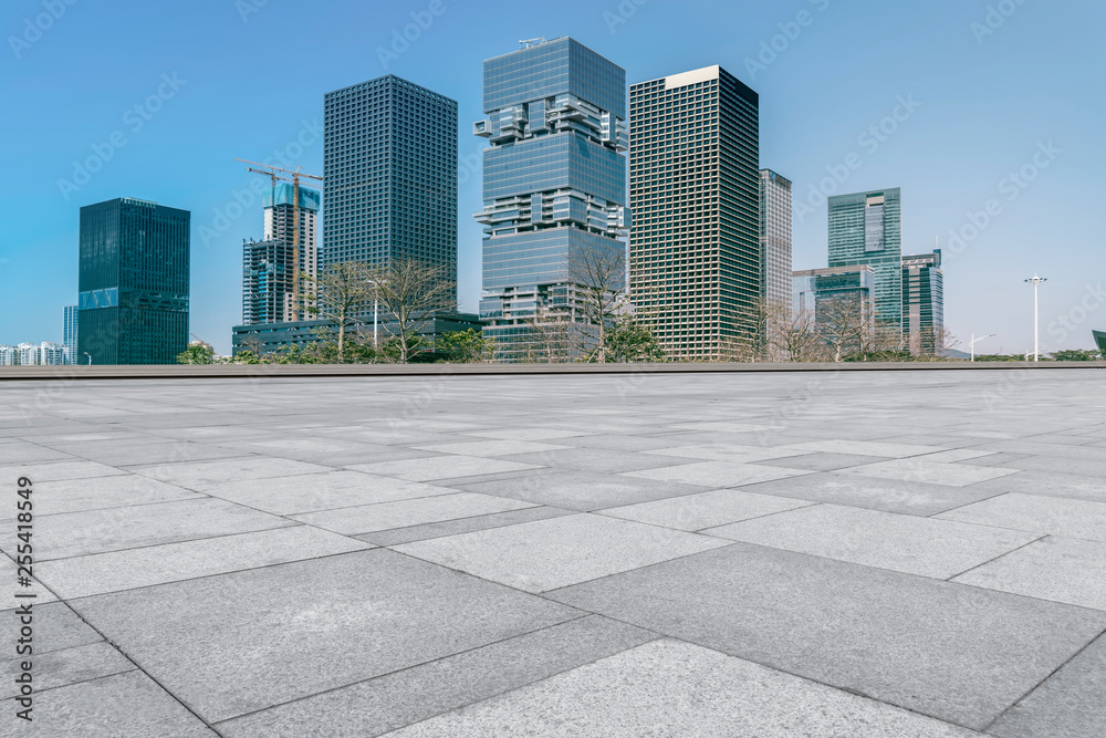 Urban skyscrapers with empty square floor tiles Urban skyscrapers with empty square floor tiles