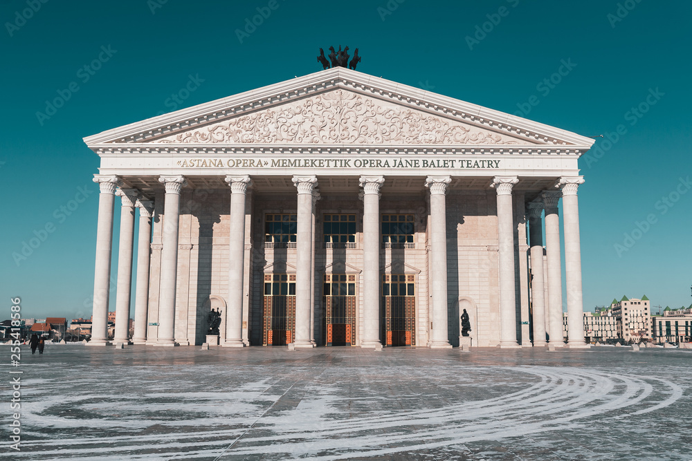 View on opera theater in Astana at the winter in the sunset light View on opera theater in Astana at the winter in the sunset light