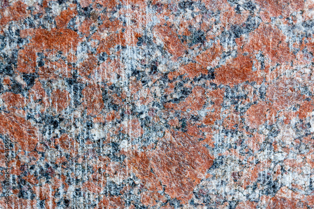 Natural mountain red granite background with impregnation of minerals Natural mountain red granite background with impregnation of minerals