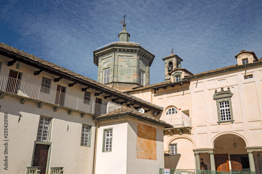 Panoramic view of the inner courtyard of the seventeenth-century monumental complex dedicated to the Virgin Mary, of the Sanctuary of Oropa in Piedmont, Italy.