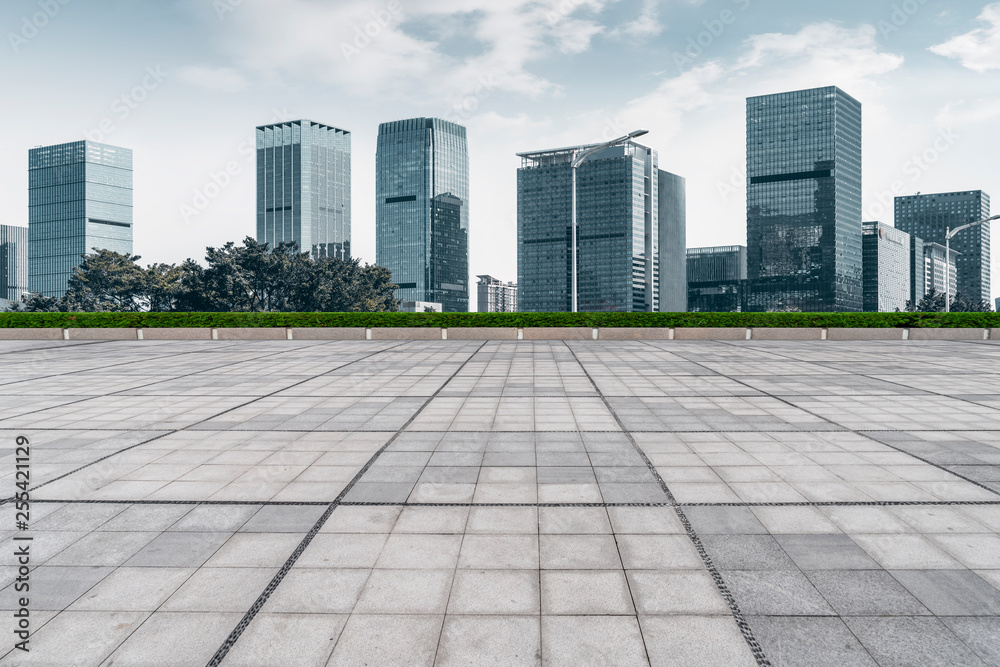 Urban skyscrapers with empty square floor tiles