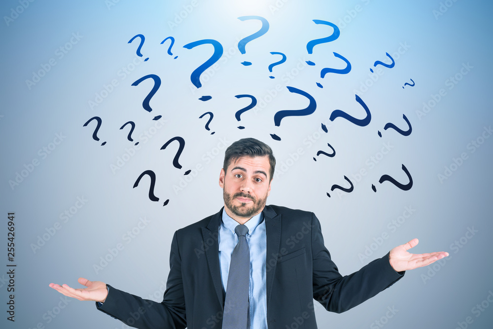 Shrugging shoulders businessman, question marks Shrugging shoulders businessman, question marks