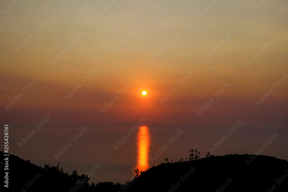 Sea, sky, sunset on horizon of mediterranean coast. Amazing sunset vibes on edge ocean. Sunrise over sea. Beautiful view, landscape and natural environment. Summer season, travel, vacation, holiday.