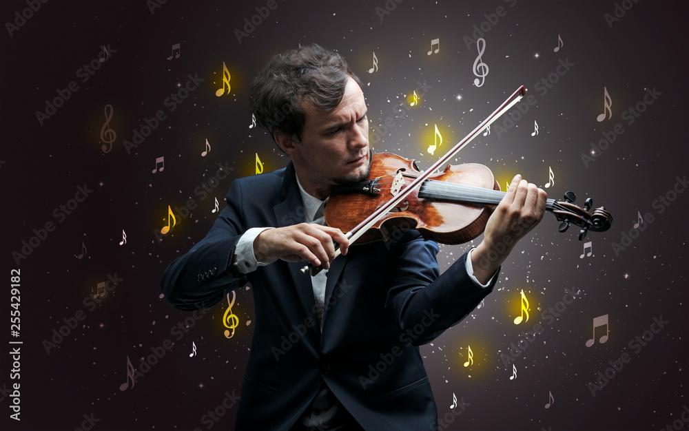 Fototapeta premium Young violinist with falling musical notes wallpaper and classical concept