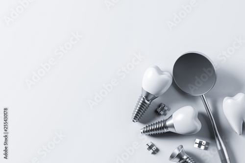 Implant screw teeth and mirror, white background photo