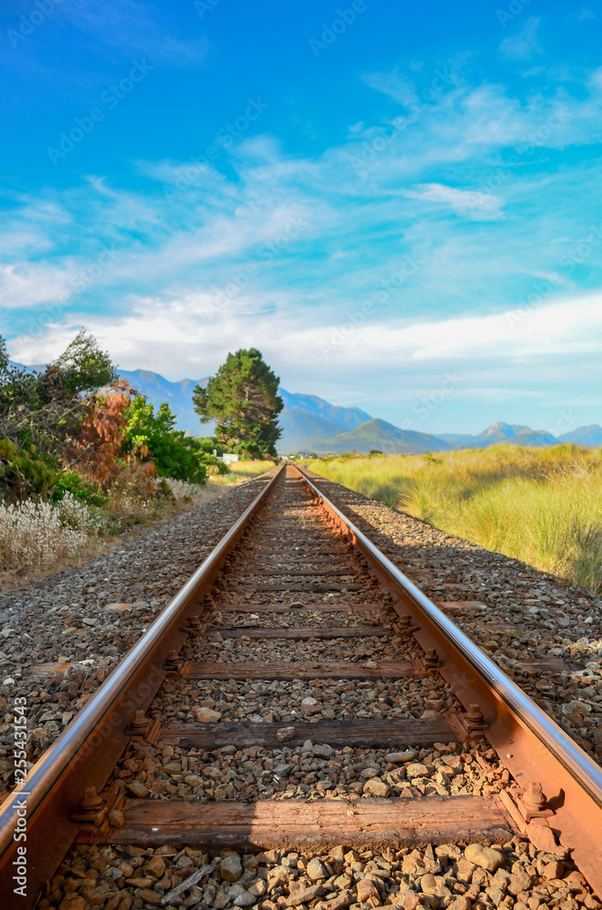 Train Tracks leading to the mountains in New Zealand Train Tracks leading to the mountains in New Zealand