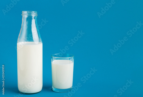 Glass bottle and glass with milk