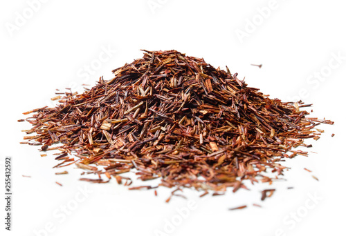 Heap of Rooibos tea on white background. Close up. High resolution
