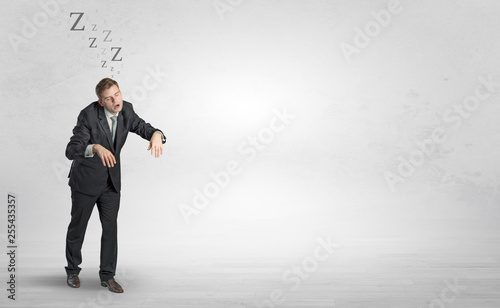 Tired businessman with sleeping sickness going somewhere
