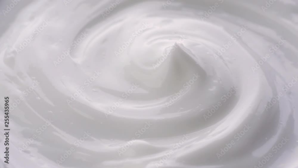 Cosmetics cream with rotate. Cream white background texture. Close-up shot. Cosmetics cream with rotate. Cream white background texture. Close-up shot.