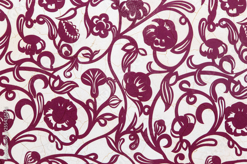 Floral purple pattern on the wallpaper