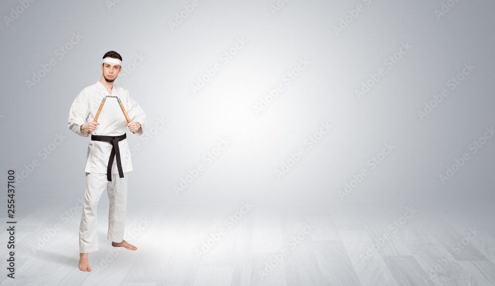 Young kung-fu trainer fighting in an empty space
Young kung-fu trainer fighting in an empty space