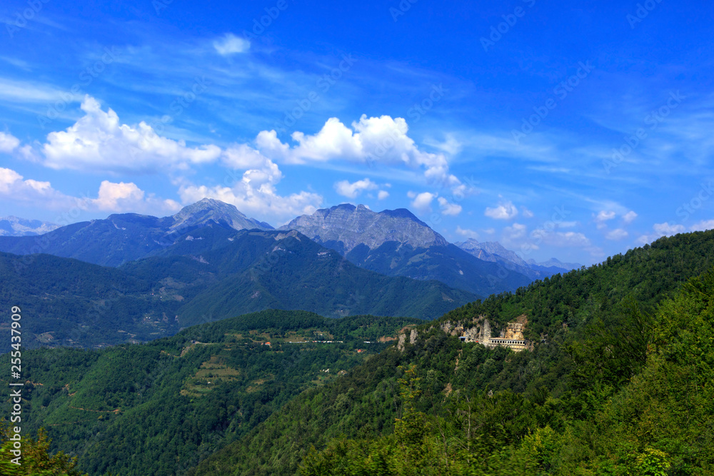 Mountain panoramic landscape of the rocky ridges of Montenegro overgrown with dense forest