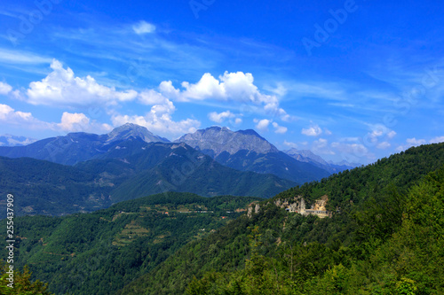 Mountain panoramic landscape of the rocky ridges of Montenegro overgrown with dense forest