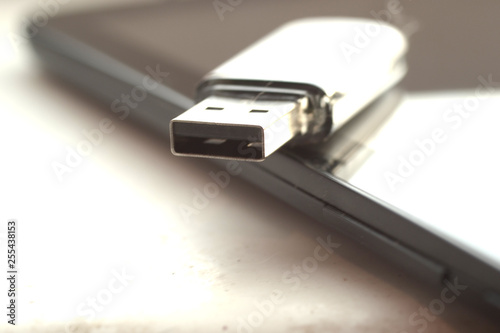 USB drive resting on tablet