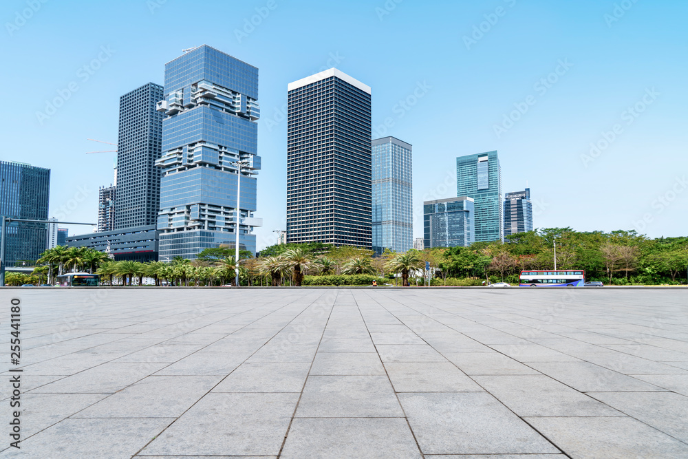 Urban skyscrapers with empty square floor tiles