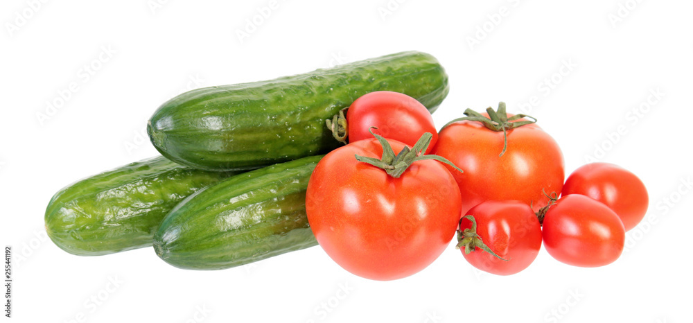 Fresh green cucumbers and red tomatoes isolated on white background. Ingredients for vegetable salad Fresh green cucumbers and red tomatoes isolated on white background. Ingredients for vegetable salad