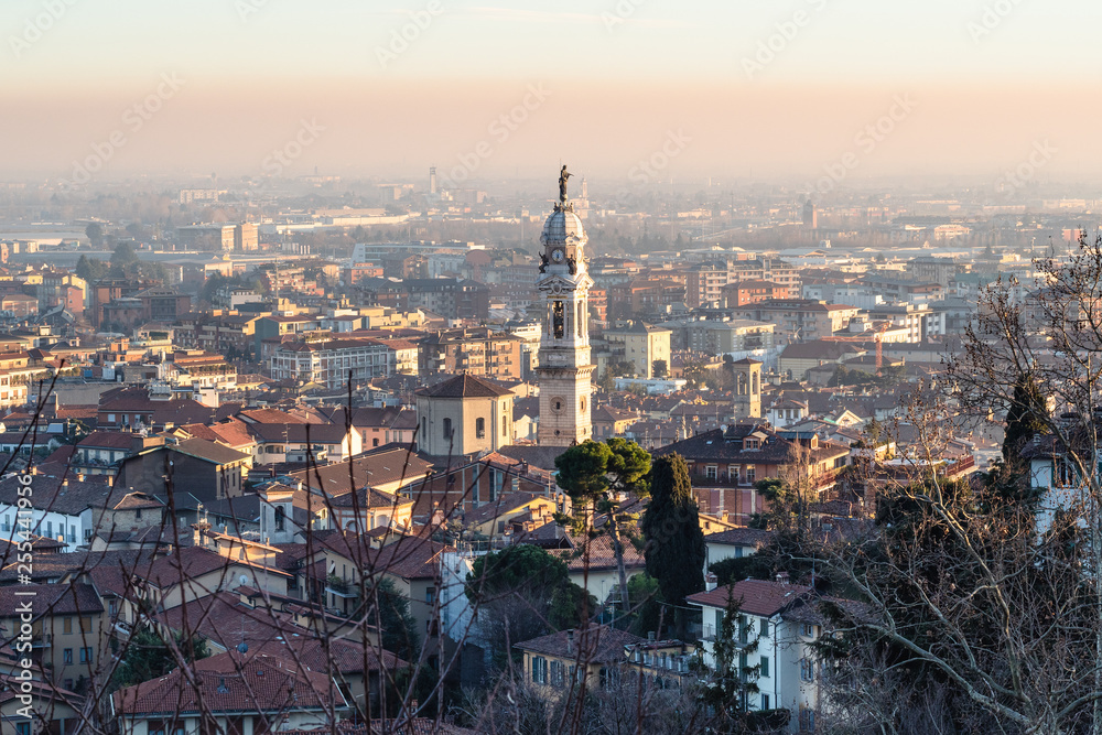 Lower Town of Bergamo with bell tower at sunset
