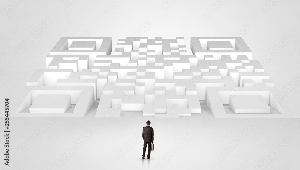Businessman standing and thinking in top of a huge maze
Businessman standing and thinking in top of a huge maze