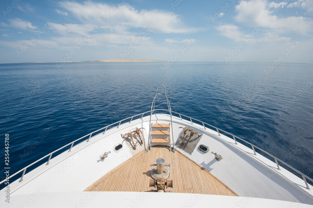 Fototapeta premium View over the bow over a large luxury motor yacht