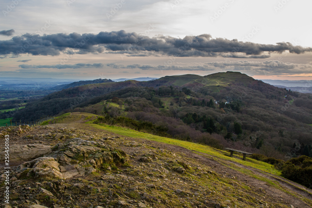 Fototapeta premium Rocky hilltop with southern part of the malvern hills including herefordshire beacon in the background