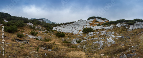 Landscape rocky mountains Styrian Alps in Austria. Peaks of rocky hills with occasionally vegetation.
