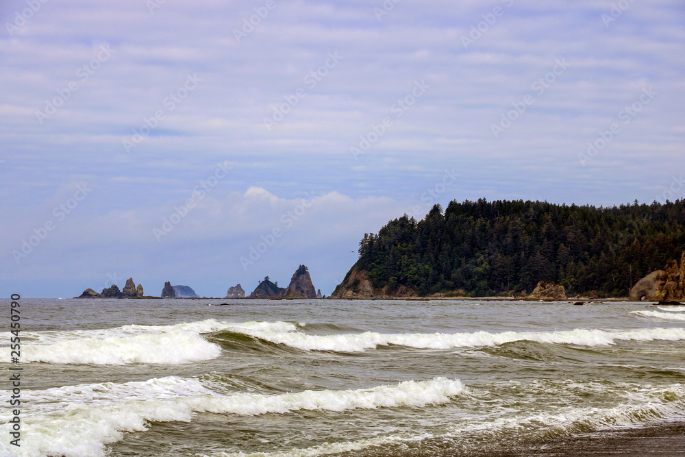 Dramatic rugged coastal seascape on the background of rocks.